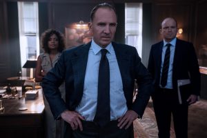 M (Ralph Fiennes), Moneypenny (Naomie Harris) and Tanner (Rory Kinnear) in a tense moment in M’s office in NO TIME TO DIE